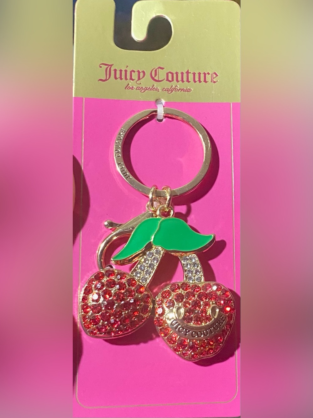 Juicy Couture cherry keychain features red crystal rhinestones and green enamel